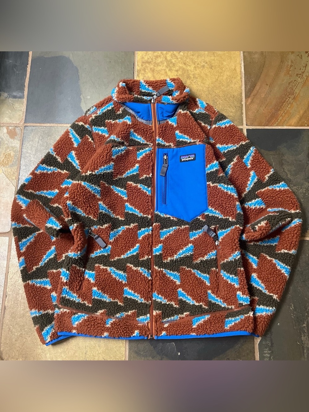 Patagonia sherpa fleece jacket in bright blue and brown pattern
